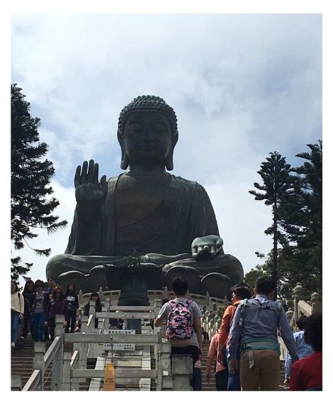 Colour photo looking up stairs towards the Big Buddha in Hong Kong.