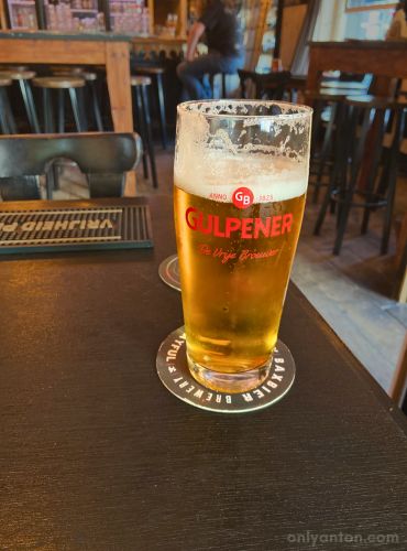 Digitally enhanced photo of a glass of Gulpener beer in Deventer, using graphic elements, textures, text, and a photo by Anton Vander Schaaf.